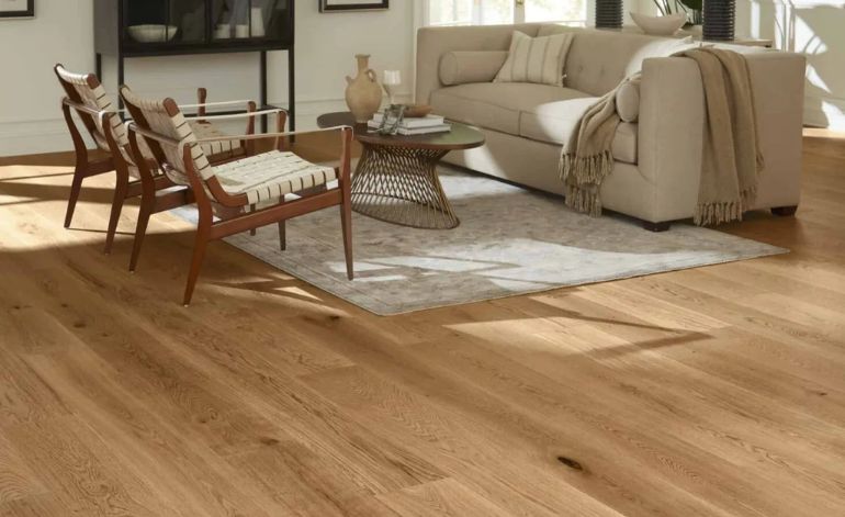 Living room with hardwood flooring and a couch, representing a comfortable setting in Sacramento, CA.